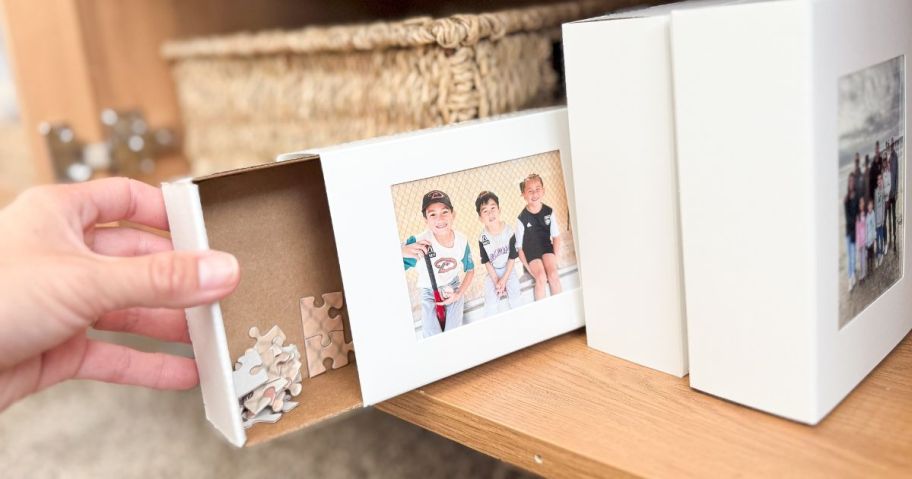 A shelf with Walgreens Photo Puzzles on it