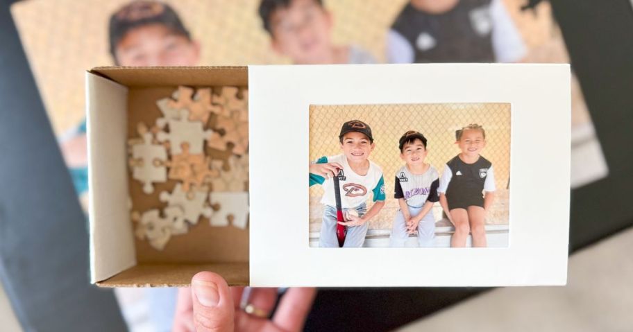 Hand holding puzzle box 
