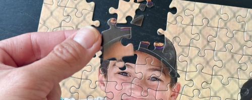 hand holding Walgreens puzzle set