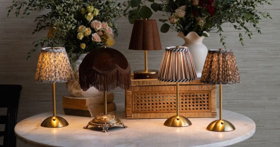 Multiple Walmart vintage collection lamps in different colors and styles