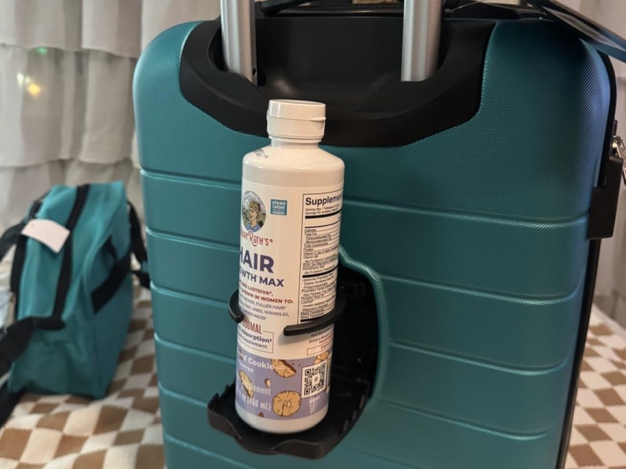 Teal carry-on with cupholder attachment