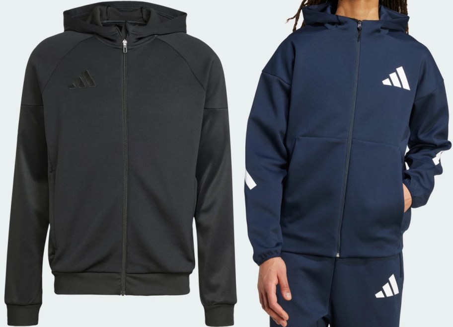 Two Adidas zip-up hoodies: a black hoodie with a black logo, and a navy blue hoodie featuring white logos and white sleeve details.