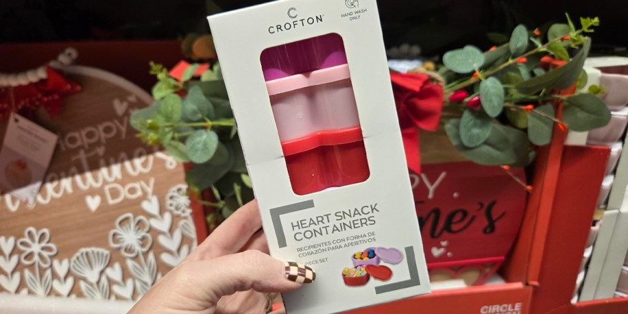 hand holdind heart snack containers 