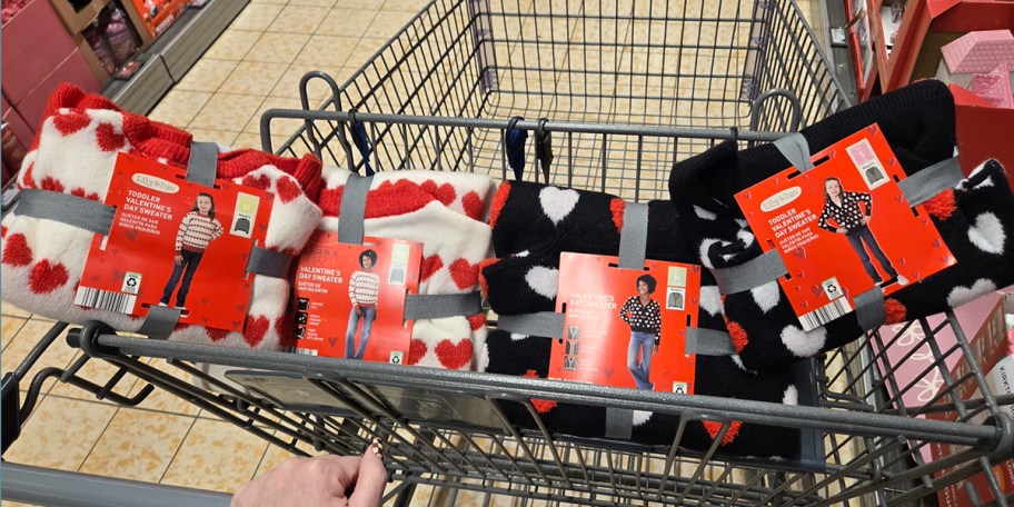 red and black valentines sweaters in shopping cart 