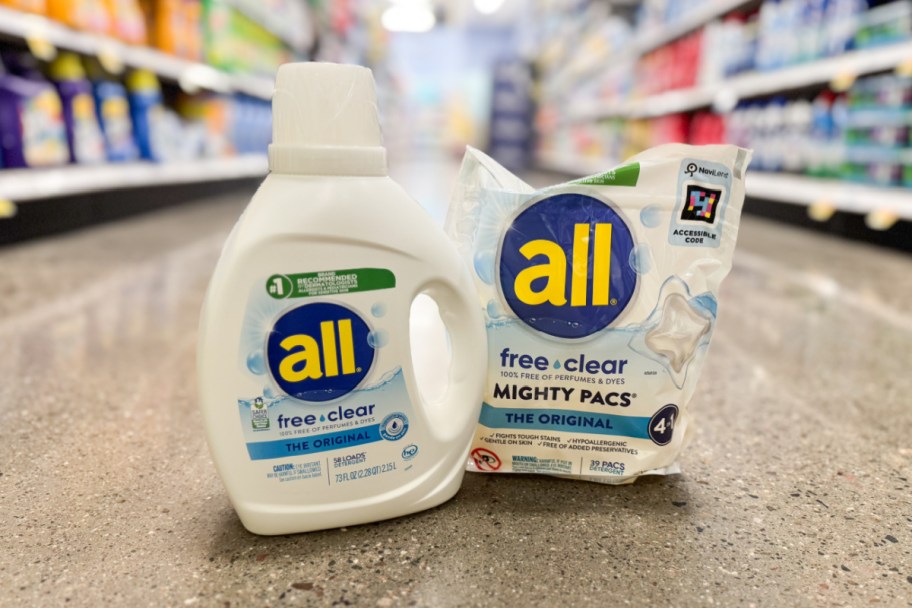 detergent bottle and pods bag on floor in grocery store