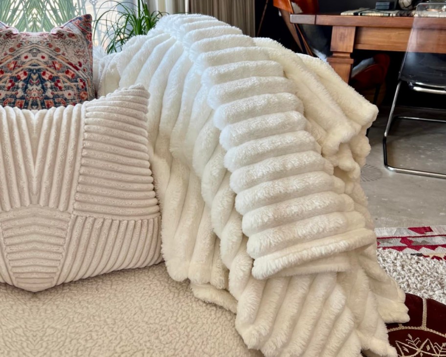 ribbed off white blanket on couch
