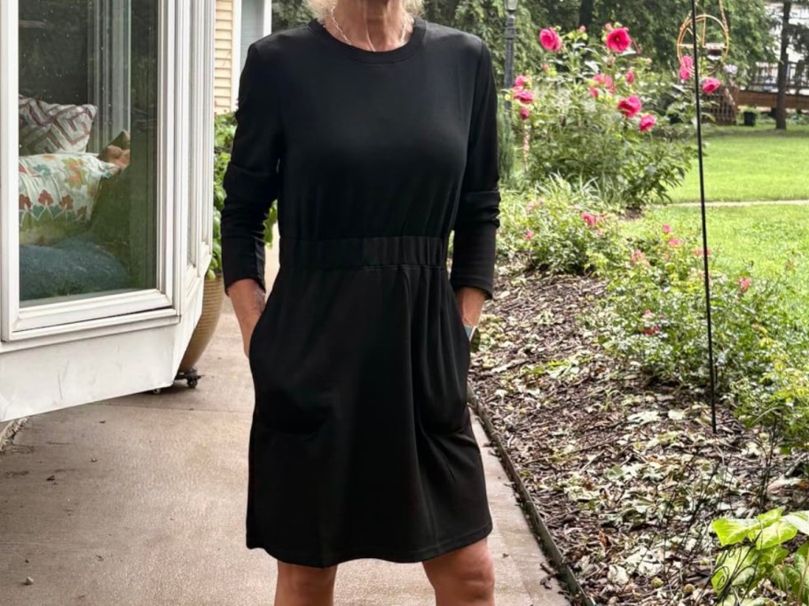 woman wearing black dress outdoors