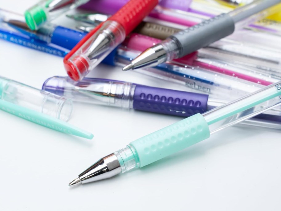gel pens on a white surface