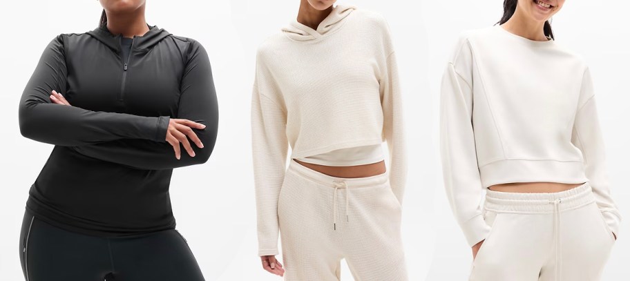 women wearing black and white hoodies 