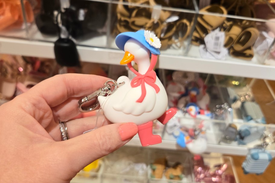 hand holding goose figure in store