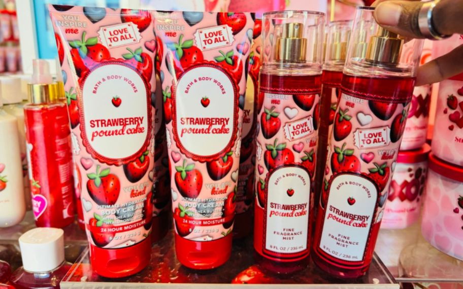four differemt bath and body works strawberry poundcake body care items