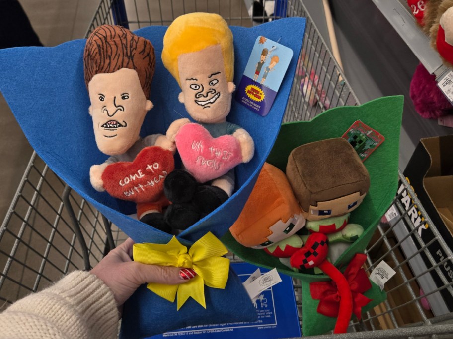 A hand holding up a Beavis & Butthead plush bouquet at Walmart.
