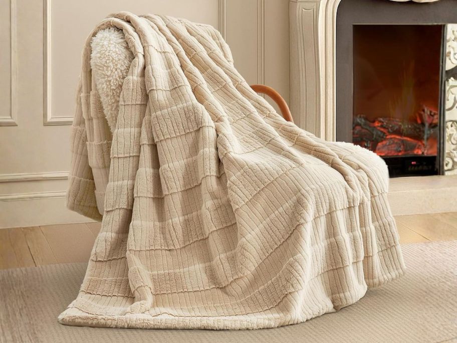 beige blanket on chair