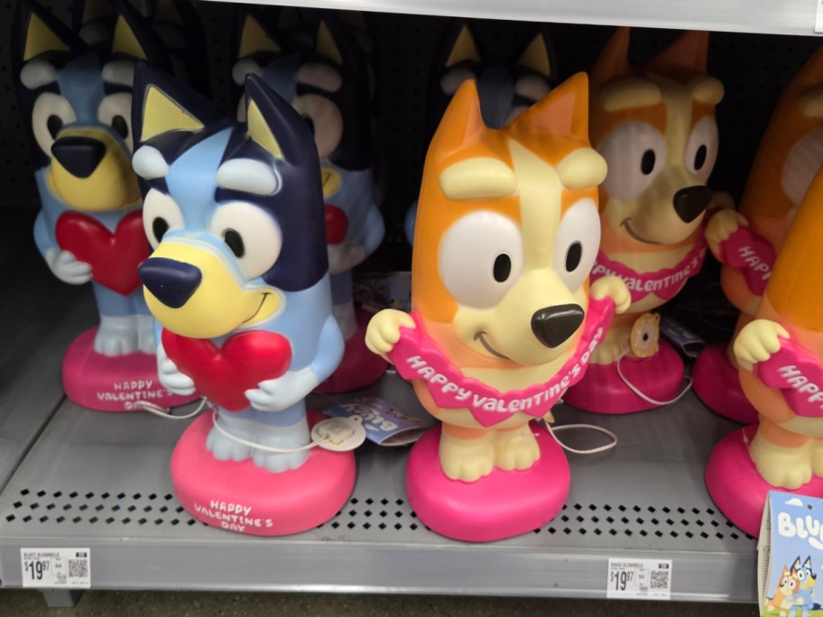 Bluey and Bingo Valentine's figurines on a shelf.