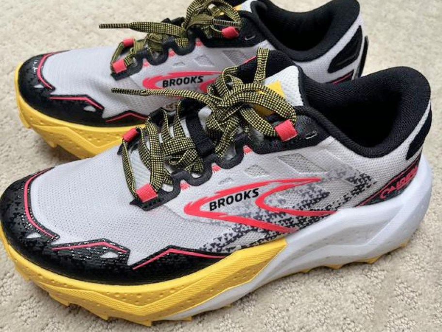 white, black, hot pick, and yellow brooks women's shoes