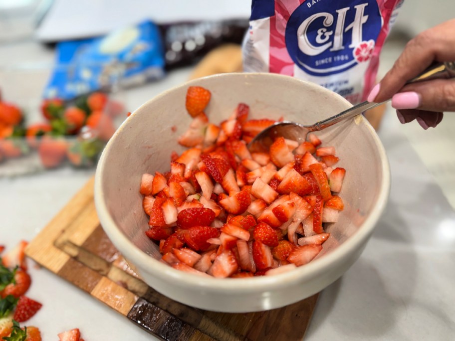 chopped strawberries in a bowl with sugar