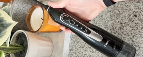 hand holding black waterpik