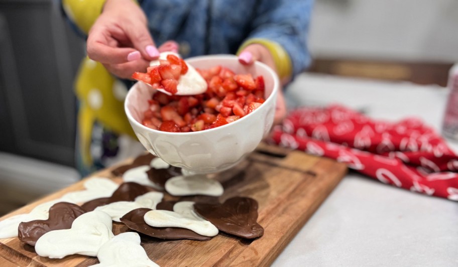 dipping chocolate into strawberries