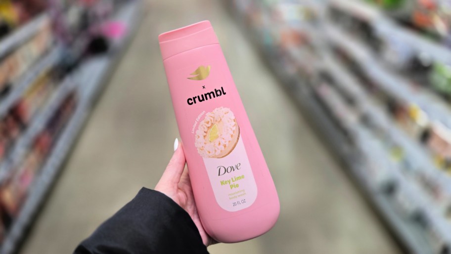 hand holding a bottle of dove crumbl key lime pie body wash