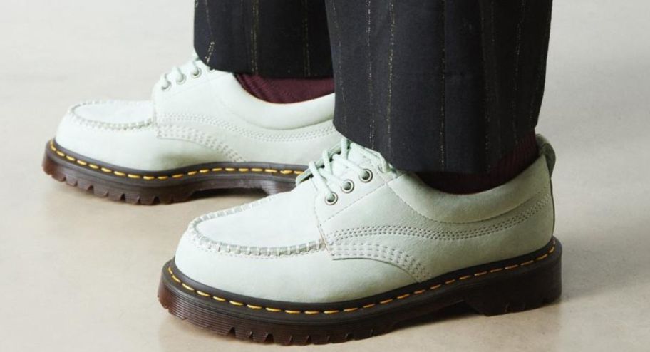 dr marten in green worn on someone 
