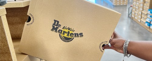 hand reaching for doc martens box