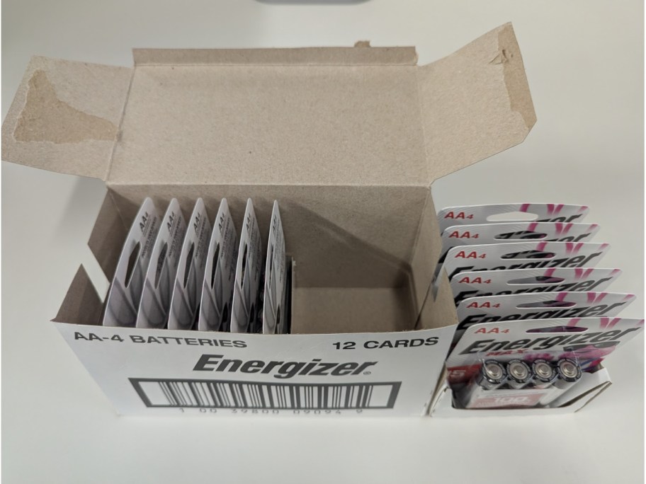 A box full of packs of AA Energizer batteries.