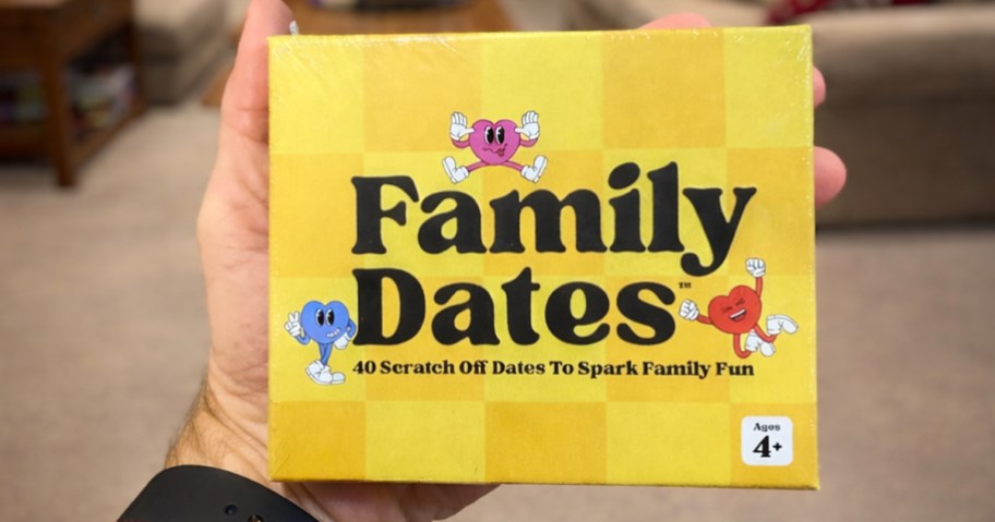 hand holding a box with family dates scratch cards