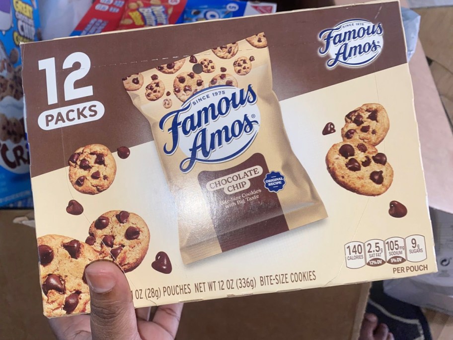 hand holding box of famous amos chocolate chip cookies 