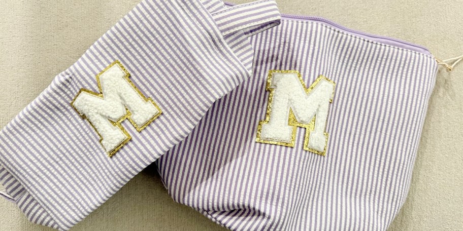 purple and white striped M cosmetic bags 