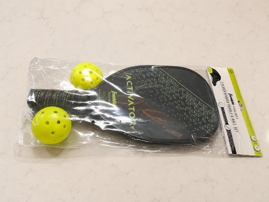 pickelball set with two balls and two paddles