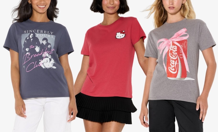 three women wearing short sleeve graphic tees