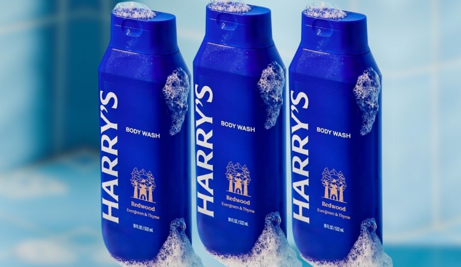3 bottles of Men's Harry's Body Wash with suds around them