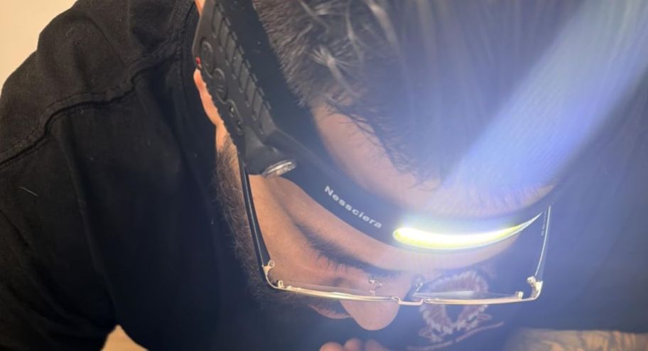 man wearing a headlamp thats on sale