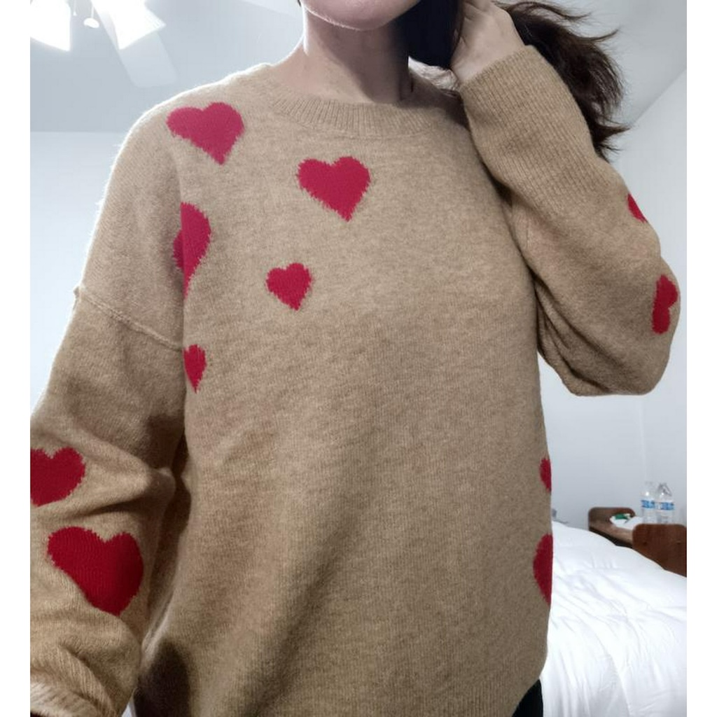 woman wearing heart sweater 