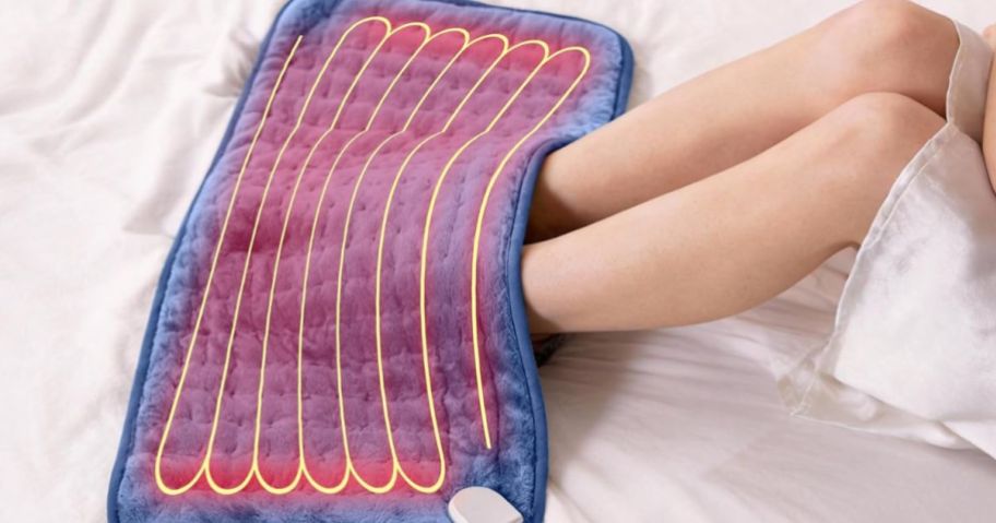 Heating pad on woman feet