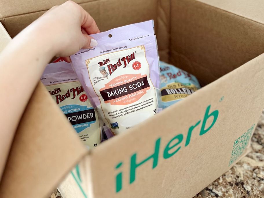 hand holding iherb baking soda order
