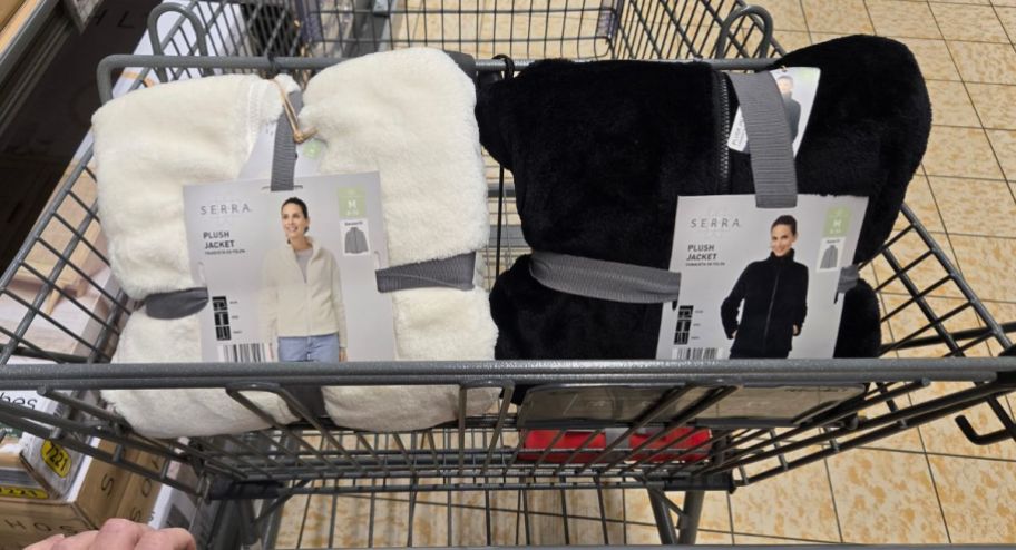 two different jackets inside of ALDI shopping cart