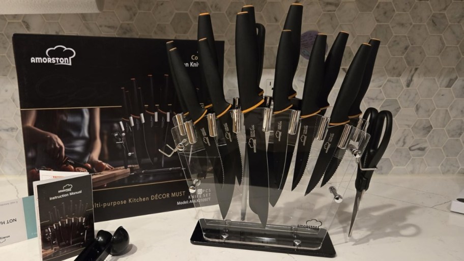 a kitchen knife set in an acrylic storage block