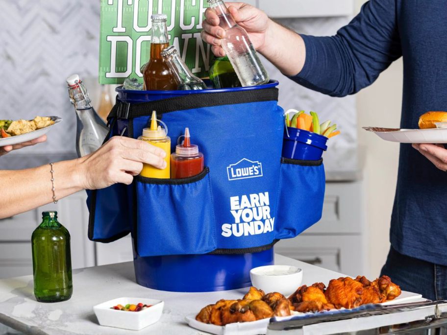 lowes bucket with belt on it holding food, drinks, and condiments at party