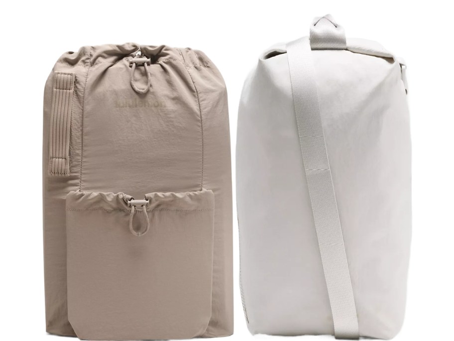 Two minimalist duffel bags are displayed: one beige with a front pocket and drawstring, the other white with a strap, both showcasing a sleek design.