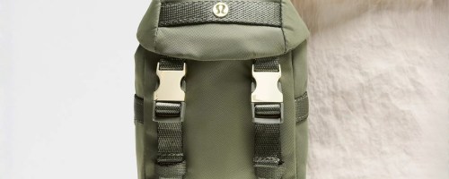 a green mini backpack attached to a regular size tote bag