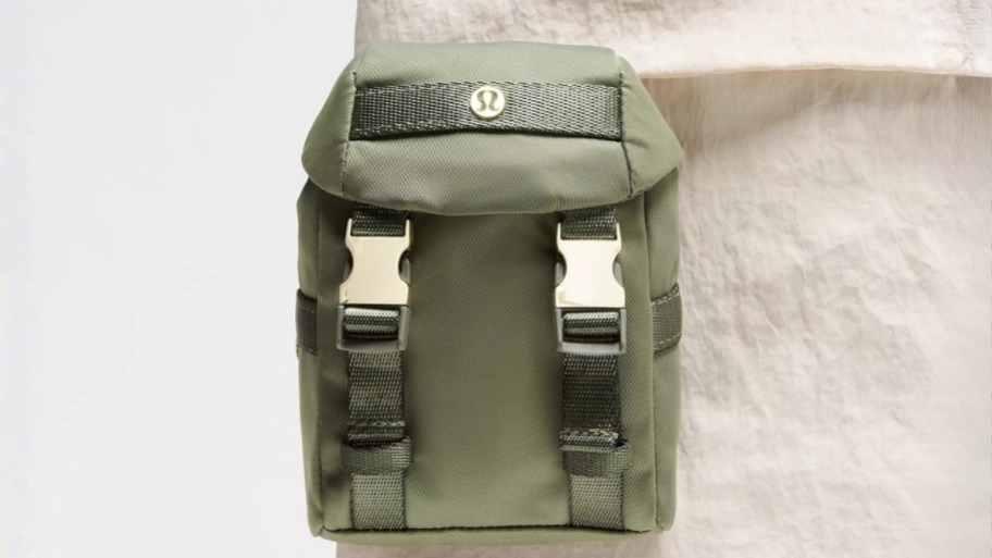 a green mini backpack attached to a regular size tote bag