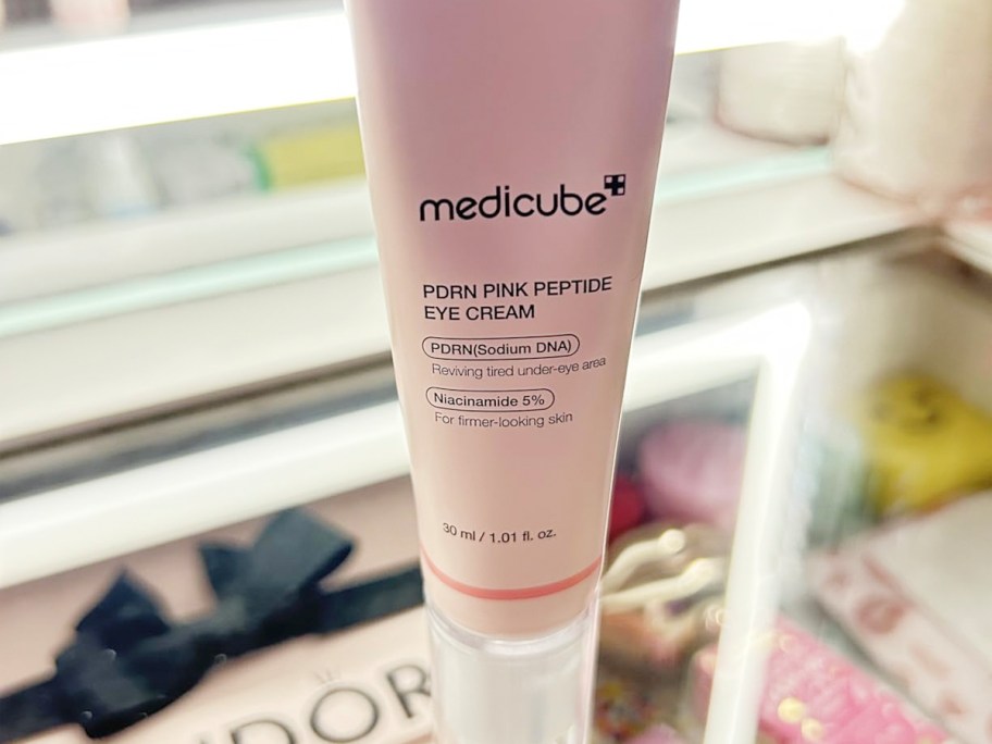 pink medicube eye serum tube on table