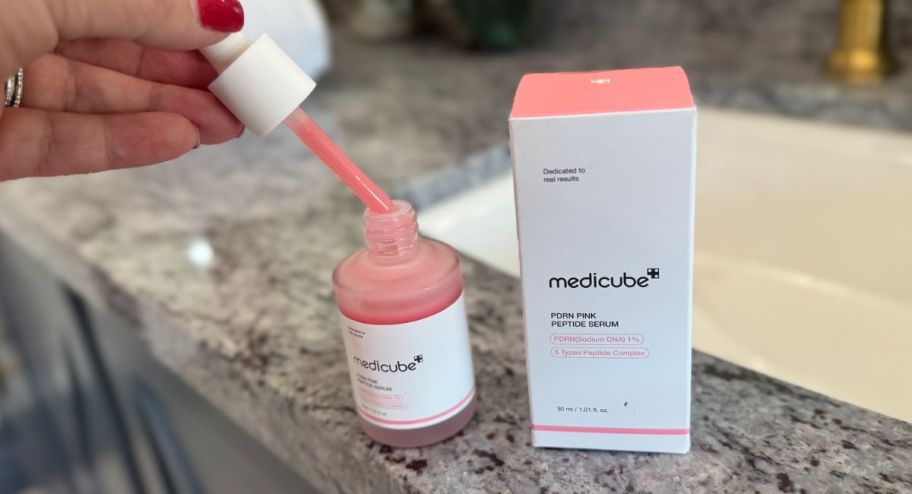 medicube peptide opened up on top of the bathroom sink