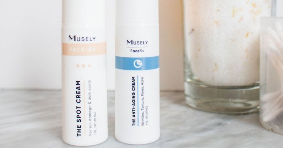 two musely products on counter in bathroom