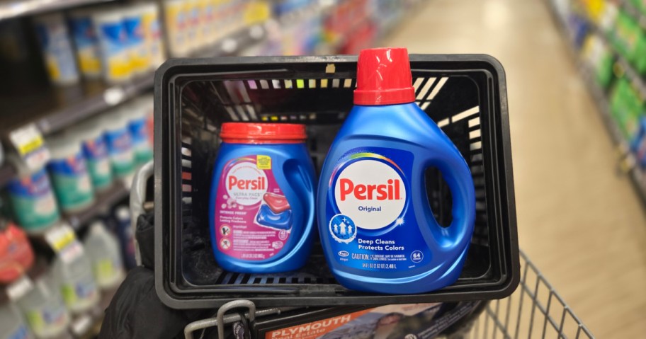 bottle of liquid persil and a container of Persil pacs in a store shopping basket