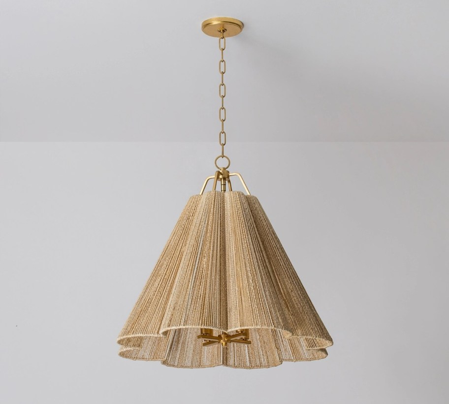 stock photo of jute pendant light hanging on gray ceiling