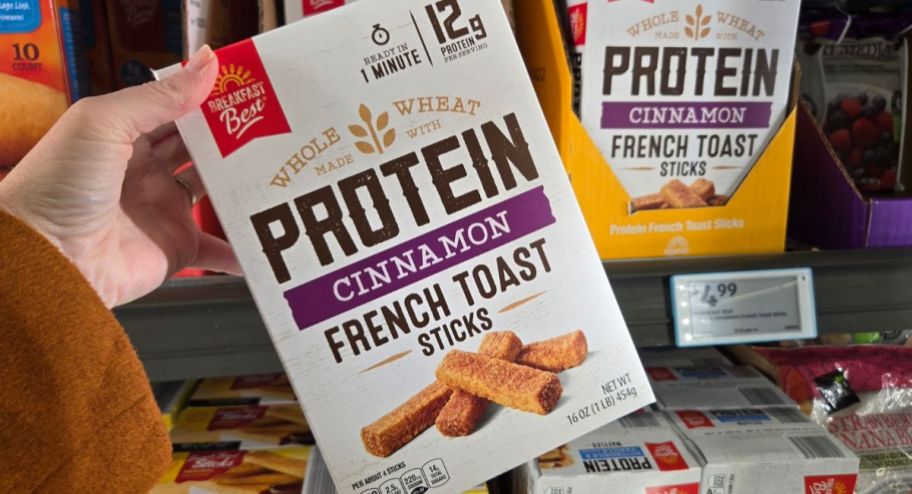 hand holding protein french toast in front of the fridge