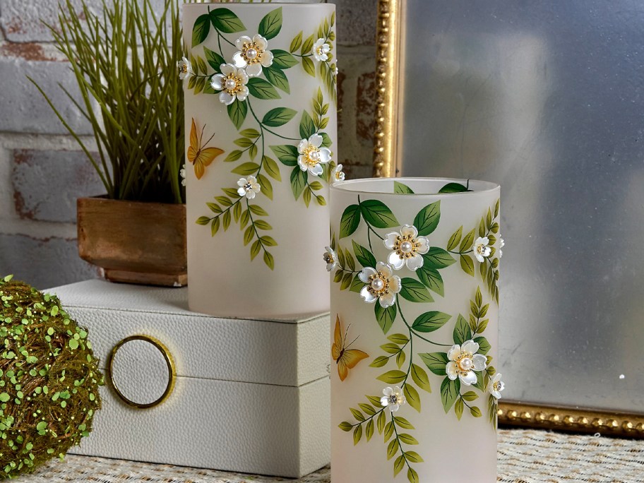 clear hurricane vase with flowers