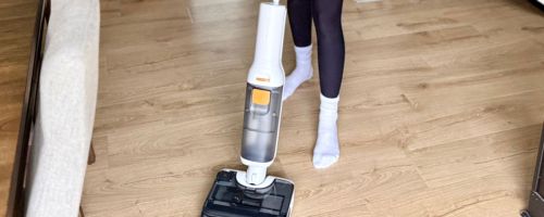 person using Roborock All-in-1 Vacuum on floor